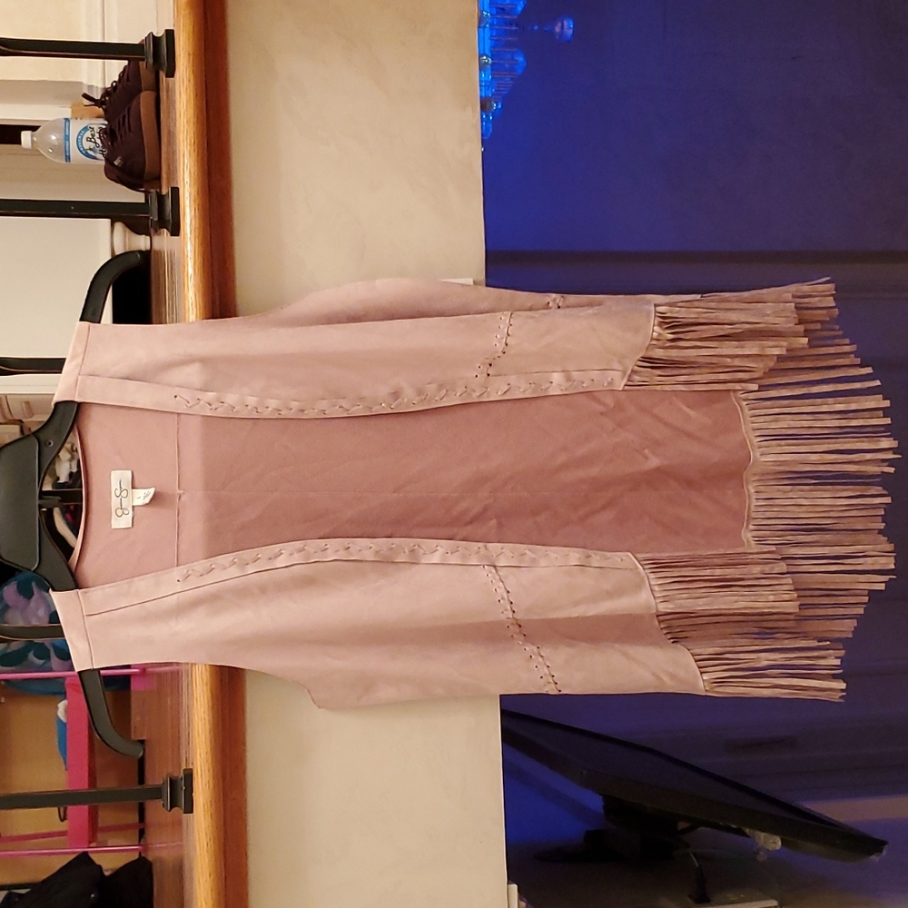 Tween girl cream sleeveless Jessica Simpson sweater.